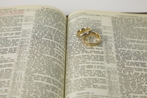 Wedding rings on an open Bible