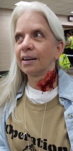 My neck laceration and face makeup in the makeup area.